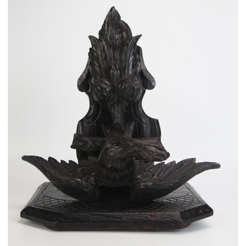 1290 - A carved hardwood wall bracket, the shelf supported by an eagle with outspread wings, overall height... 