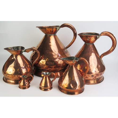 1291 - A matched set of six 19th century copper graduated measures, of traditional design,