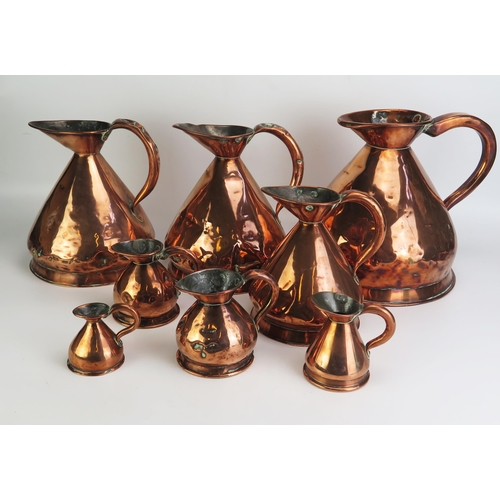 1292 - A collection of eight assorted 19th century copper measures, of traditional design. (8).