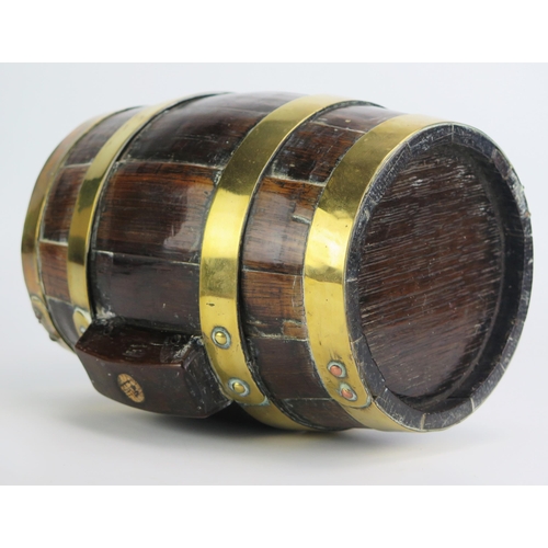 1293 - A 19th century oak and brass bound firkin of coopered construction with brass bands, 24cm long.