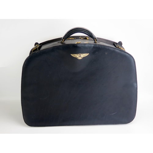 1295 - A Bentley stitched leather travelling case, with Bentley winged logo, with two compartments, having ... 