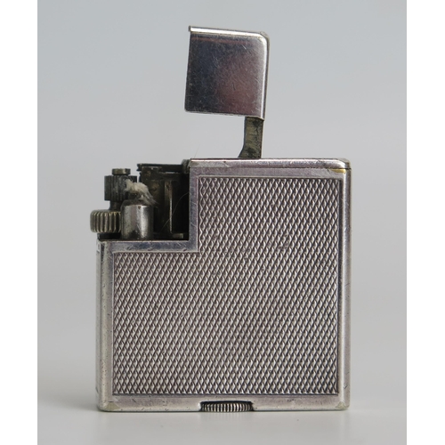 1296 - Alfred Dunhill vintage Paris Savory Silver Plate petrol Lighter, with engine turned decoration, seri... 