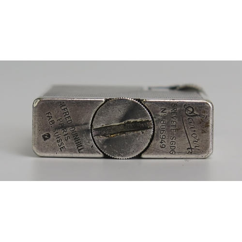 1296 - Alfred Dunhill vintage Paris Savory Silver Plate petrol Lighter, with engine turned decoration, seri... 