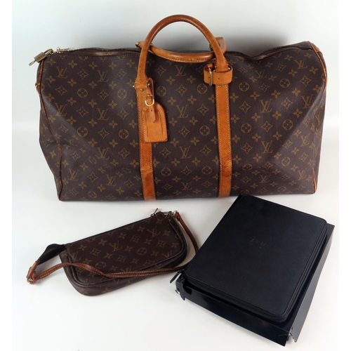 1305 - Louis Vuitton, a vintage monogram Keepall 50 luggage bag, serial No AAA888, (lacks shoulder strap), ... 