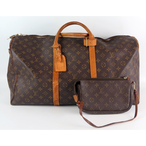 1305 - Louis Vuitton, a vintage monogram Keepall 50 luggage bag, serial No AAA888, (lacks shoulder strap), ... 