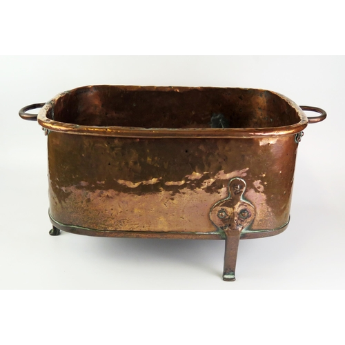 1339 - An 18th century Dutch brass  basin, of rectangular outline with loop carrying handles raised on thre... 