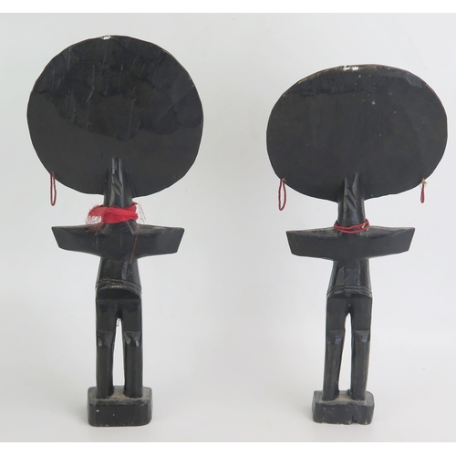 1340 - A pair of Ashanti fertility dolls, of traditional design 34cm high