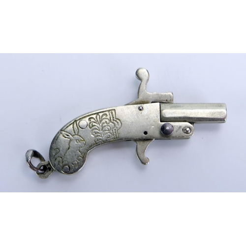 1391 - An early 20th century miniature pistol, obsolete calibre, 4cm long.