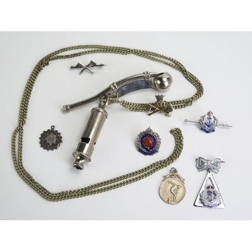 1393 - A plated bosun's whistle and chain, a 'Metropolitan whistle and assorted lapel badges.