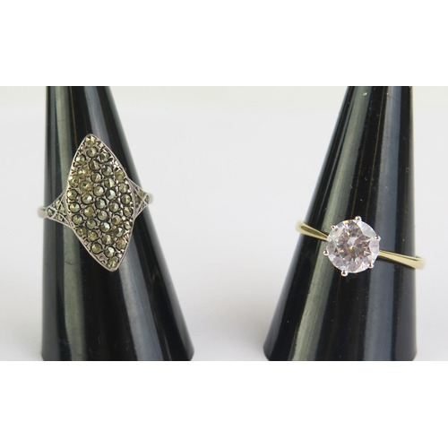 146 - A 14ct Gold and CZ Solitaire Ring, size T.25, 2.33g gross and a 9ct Gold and Silver Ring, size M.5, ... 