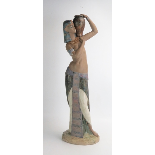 1493 - A Lladro figure of an Egyptian water carrier, 57cm high.