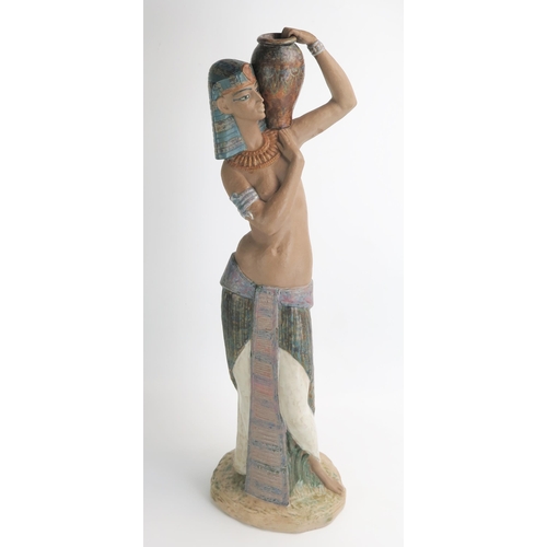 1493 - A Lladro figure of an Egyptian water carrier, 57cm high.