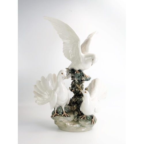 1495 - A large Lladro group of doves on a rocky outcrop, 51cm high