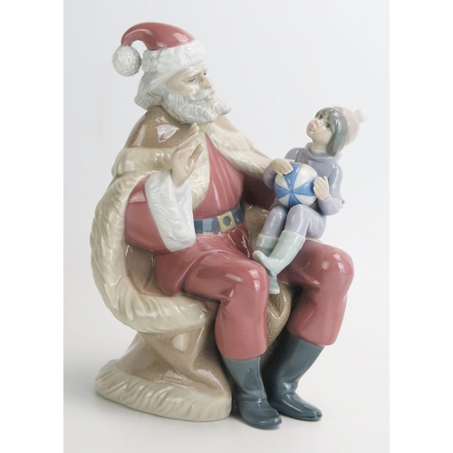 1502 - A Lladro figure group 'Papa Noel' No 5711, 19cm high, boxed.