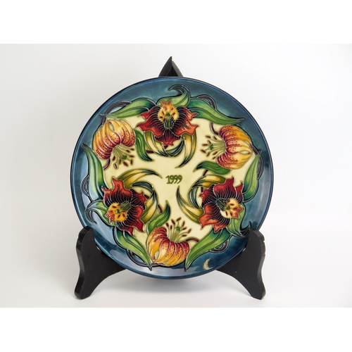 1517 - A Moorcroft pottery limited edition Year plate, '1999' designed by Nicola Slaney, No 647/750, 22cm d... 