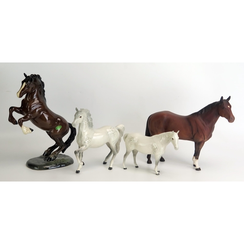 1520 - A Beswick model of 'Welsh Cob Rearing' Model No 1014, 26cm high, together with 'Quarter Horse', 25cm... 