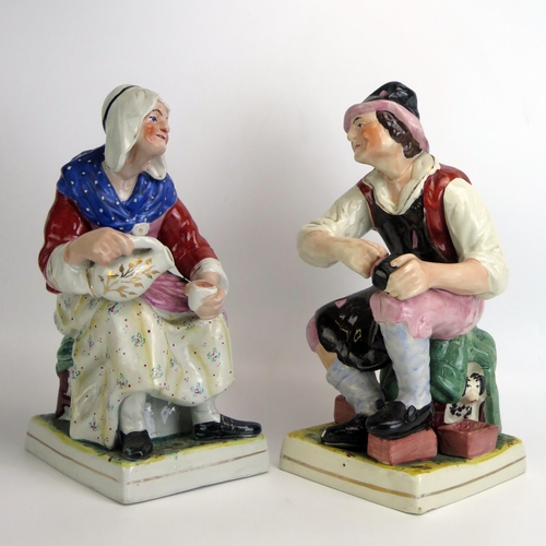 1537 - A pair of Staffordshire pottery figures 'The Cobbler and His Wife', 31cm high