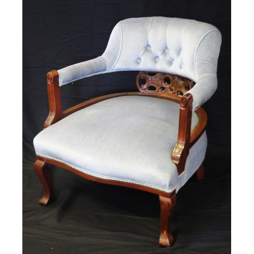 1600 - An Edwardian mahogany salon chair, with stuff-over rail back, with stuff over seat raised on swept f... 