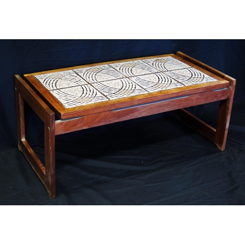 1608 - A vintage teak coffee table, the rectangular tiled top on square shaped supports, 98cm wide.