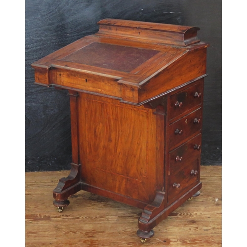 1611 - A Victorian walnut and satinwood strung davenport, with hinged writing surface enclosing a fitted in... 