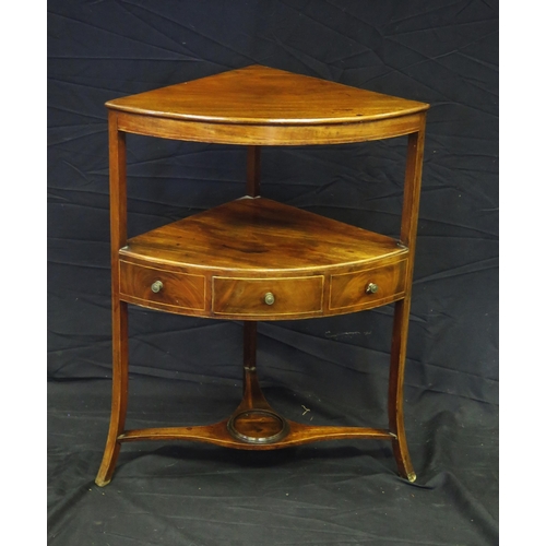 1614 - A Georgian mahogany corner washstand, with single frieze drawer, on swept legs united by an under-ti... 