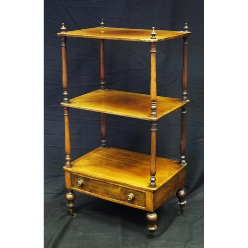 1617 - A Victorian mahogany three tier what not, with turned columns with single drawer to the base, on tur... 