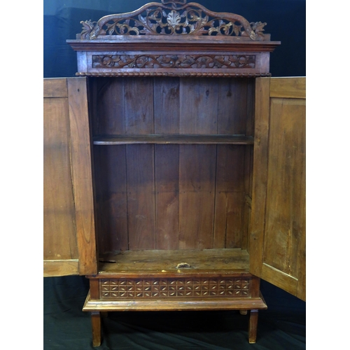 1626 - A continental walnut cabinet, with arched and carved foliate and scroll pediment, floral decorated f... 