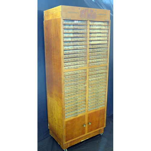 1627 - A Dewhurst's machine twist SYLKO haberdashery cabinet, with glazed front sliding drawers for cotton ... 