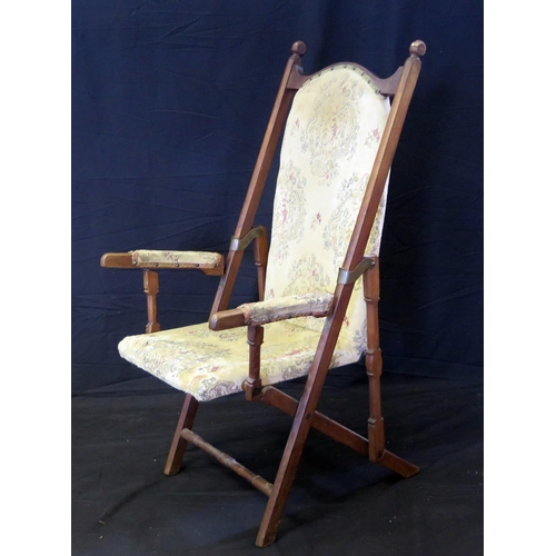 1629 - A Victorian walnut folding campaign chair, with padded back and seat, padded arm supports, on swept ... 