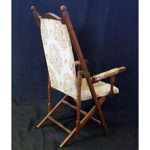 1629 - A Victorian walnut folding campaign chair, with padded back and seat, padded arm supports, on swept ... 