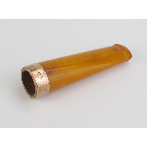 163 - An Amber Cheroot Holder with a 9ct gold hallmarked mount,  7.55g gross