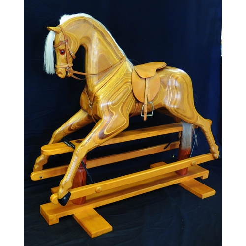 1632 - Relko, Devon, a late 20th century polished wood rocking horse, with open mouth, flared nostrils, ins... 