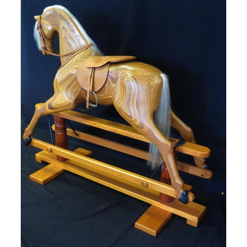 1632 - Relko, Devon, a late 20th century polished wood rocking horse, with open mouth, flared nostrils, ins... 