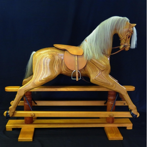 1632 - Relko, Devon, a late 20th century polished wood rocking horse, with open mouth, flared nostrils, ins... 