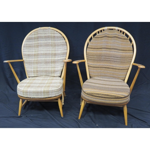 1634 - A pair of Ercol elbow chairs, with loose cushion padded back and cushion  seat, raised on turned und... 