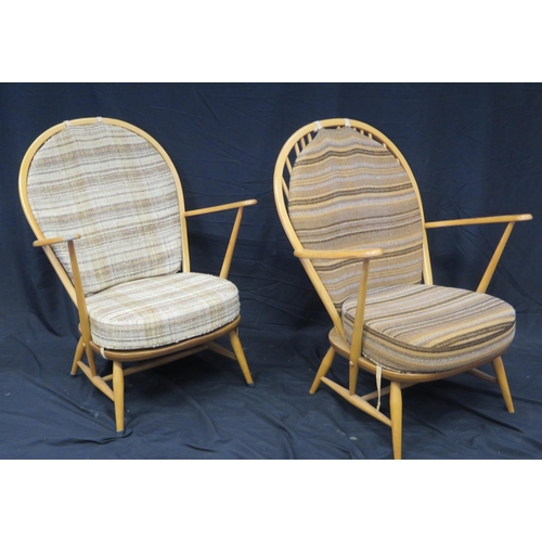 1634 - A pair of Ercol elbow chairs, with loose cushion padded back and cushion  seat, raised on turned und... 