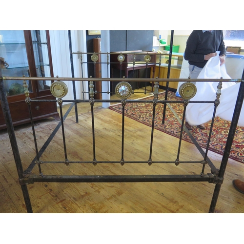 1636 - A Late Victorian tubular metal four-poster double bed, with bed ends, side rails and drapery runners... 