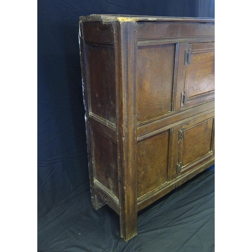 1638 - An 18th century oak dresser, with ledged top, with panelled cupboard door having pierced floral deco... 