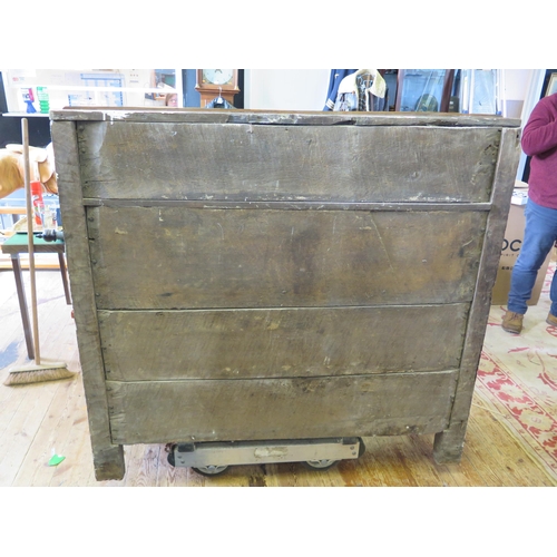 1638 - An 18th century oak dresser, with ledged top, with panelled cupboard door having pierced floral deco... 