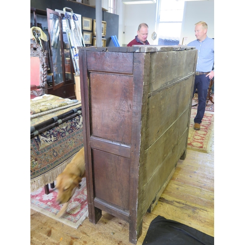 1638 - An 18th century oak dresser, with ledged top, with panelled cupboard door having pierced floral deco... 