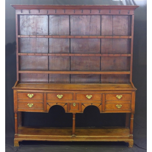 1649 - An 18th century oak dresser, with shelved and planked superstructure, the base with shaped apron wit... 