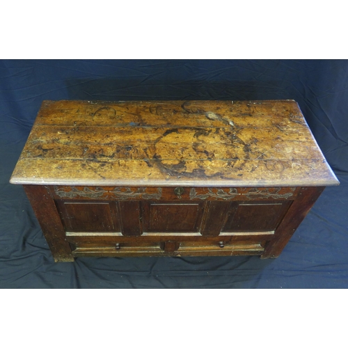 1650 - A late 18th century oak mule chest, of rectangular outline, with hinged lid, triple panelled front w... 