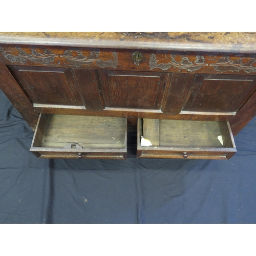 1650 - A late 18th century oak mule chest, of rectangular outline, with hinged lid, triple panelled front w... 