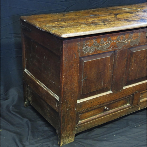 1650 - A late 18th century oak mule chest, of rectangular outline, with hinged lid, triple panelled front w... 