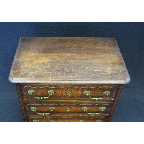 1655 - A continental oak chest of rectangular outline, the top with a moulded edge, containing three drawer... 