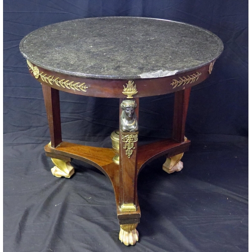 1657 - A 19th century French Empire Egyptian revival circular table, with black marble top with a moulded e... 