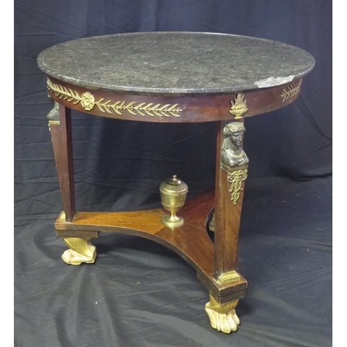 1657 - A 19th century French Empire Egyptian revival circular table, with black marble top with a moulded e... 