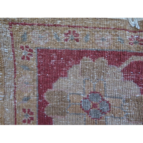 1659 - An Afghan Zeigler rug, the main beige field, with central wine red medallion, within trailing foliag... 