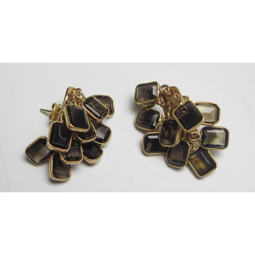 198 - A Pair of Middle Eastern 18ct Gold and Smoky Quartz Earrings, stamped 750 to the butterflies, 13.45g... 