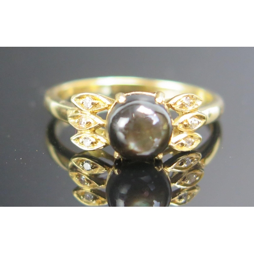 200 - A Libyan Star Sapphire and Diamond Ring in an unmarked precious yellow metal setting, KEE tested as ... 